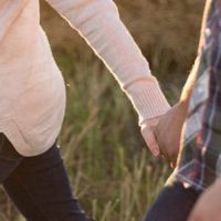 husband and wife hand in hand