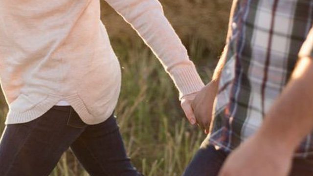 husband and wife hand in hand